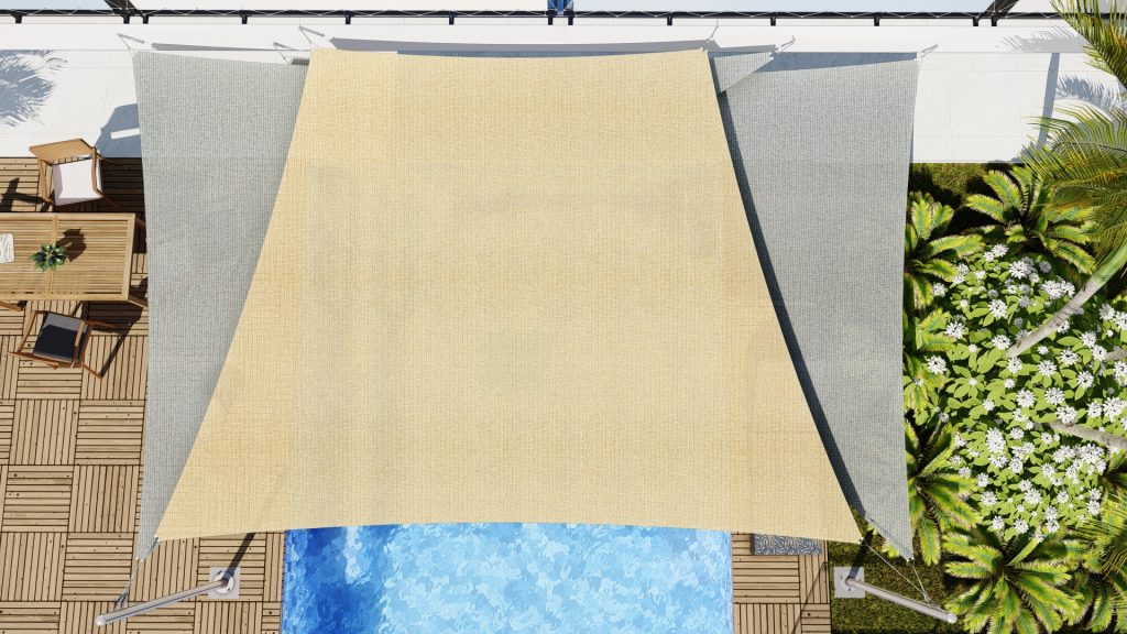 association de deux voiles d'ombrage triangulaire et d'une voile d'ombrage trapézoïdale sur une piscine à débordement.